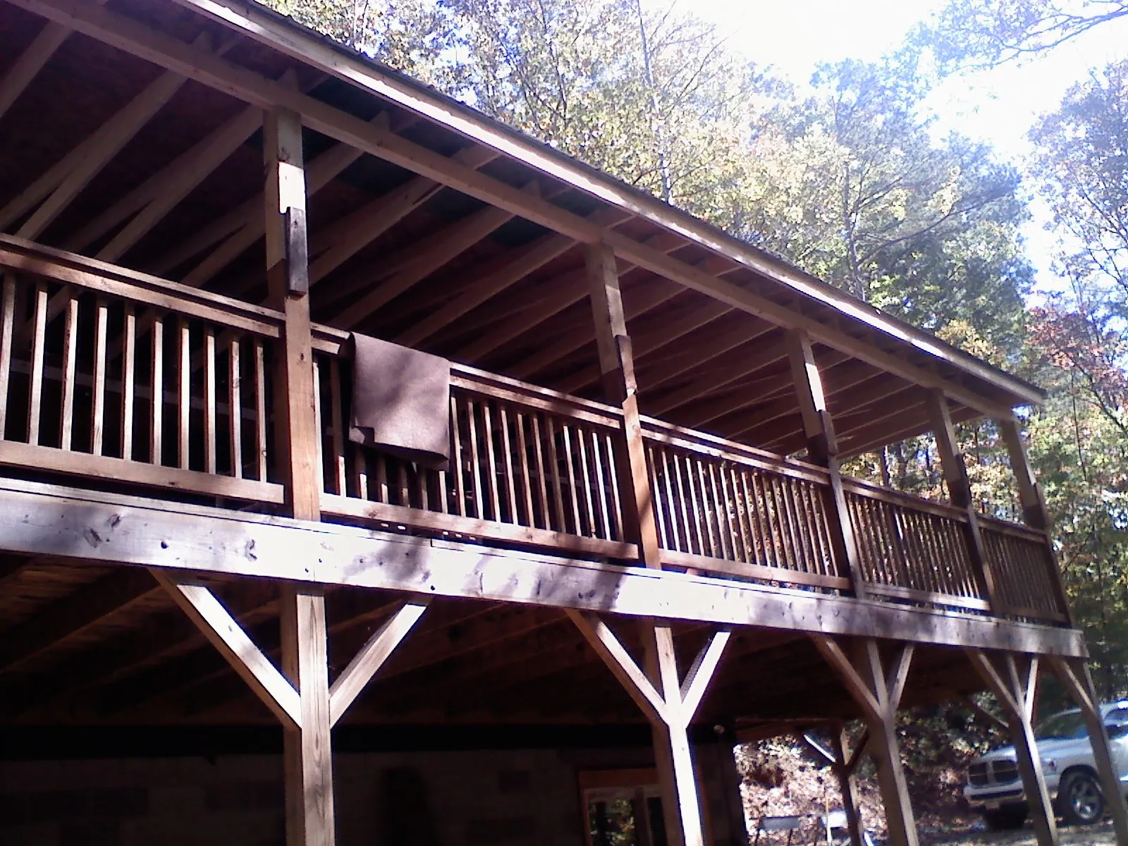 Timber framing under a new elevated porch and deck — Roof Leak Repair in Santa Fe by Roofing Brothers